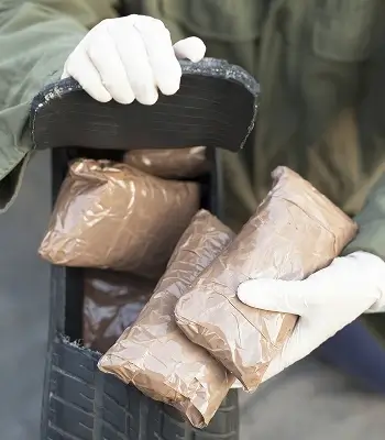 a person holding packages in their hands