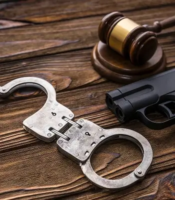 a gun and handcuffs on a table