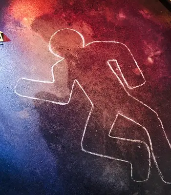 a person drawn in chalk on the ground