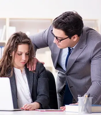 a man touching a woman's shoulder