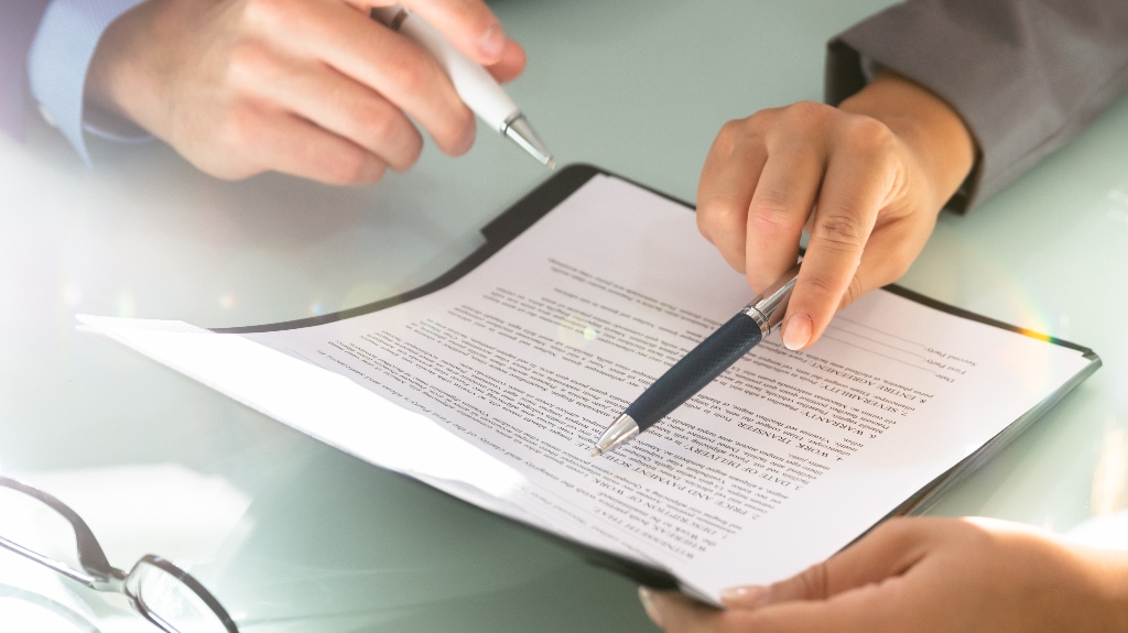 man and lawyer are working through documents