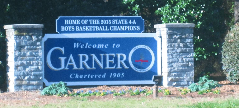 Welcome sign for Garner, noting it as the home of the 2015 State 4-A Boys Basketball Champions, established 1905.